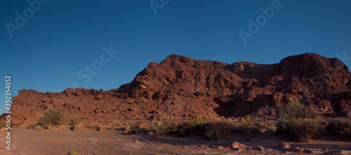 The red canyon. Panorama view of the arid desert, valley, sandstone and rocky formations and mountains in Talampaya national park in La Rioja, Argentina.