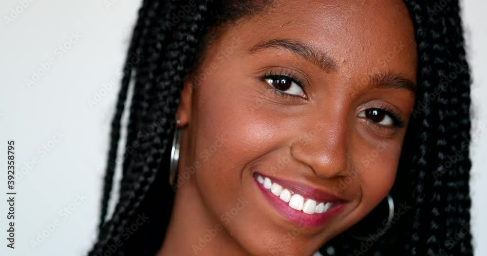 Pretty black African girl posing to camera. Teenager young woman portrait Pretty black African girl posing to camera. Teenager young woman portrait