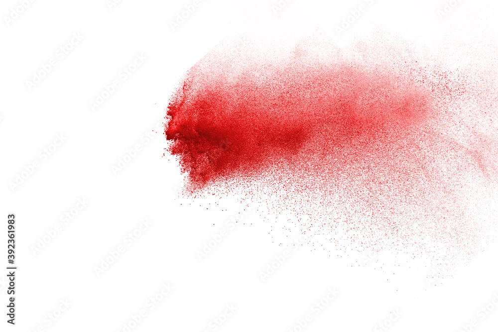 Red powder explosion isolated on white background.
