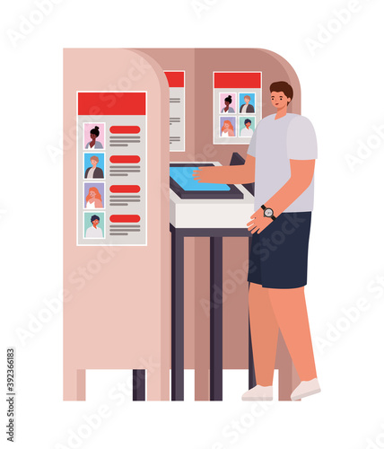 man with brown hair, gray shirt and wristwatch in a voting booth