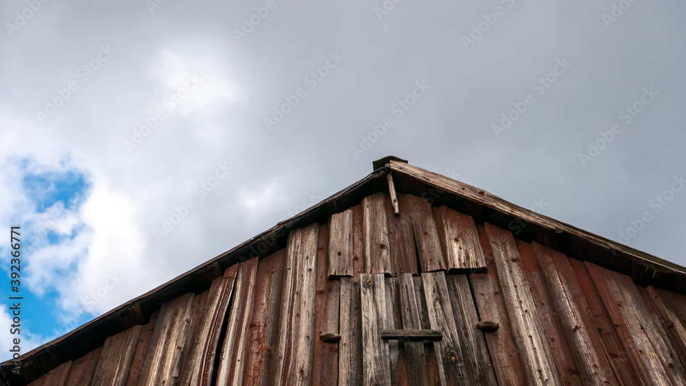 Roof made of boards on a background of gray sky Roof made of boards on a background of gray sky