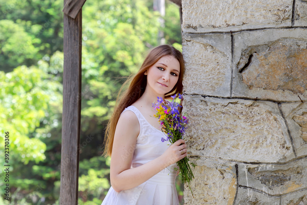 Samolepka Young woman with wildflowers