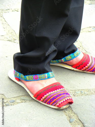Feet of indigenous man dancer in  alpargatas  which is traditional shoes of Sierra  Mountains  region and Otavalo people