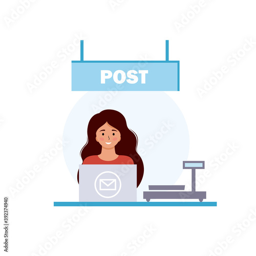 The postal operator at the workplace accepts the parcel. Post office, sending parcels and letters. Scales for weighing parcels. The girl is working on a laptop.