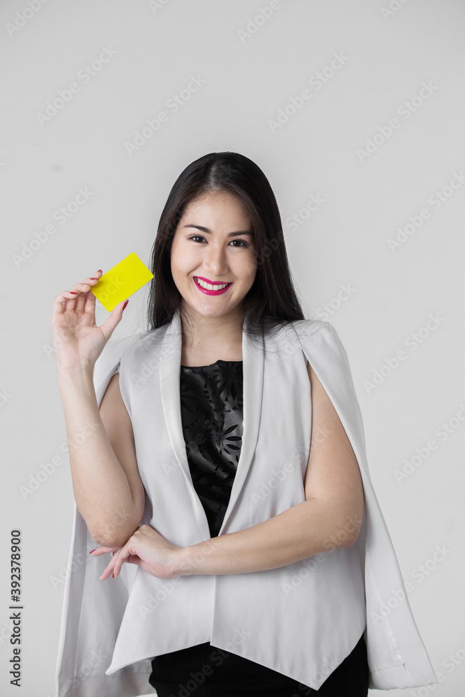 Asian woman presenting credit card in hand, woman holding credit card Asian woman presenting credit card in hand, woman holding credit card