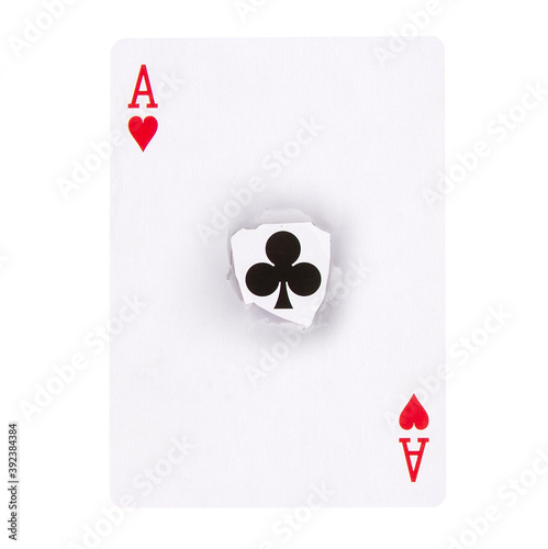 Ace of hearts card with a ripped part in the middle releveling ace of clubs - hidden meaning concept photo