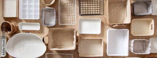 Flat lay of Marie Kondo's storage boxes, containers and baskets with different sizes and shapes photo