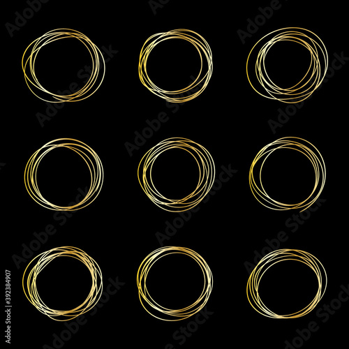 Set of messy golden circle frames on a black background