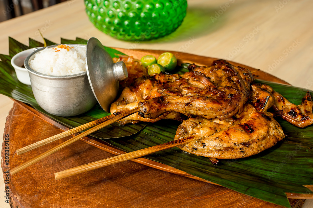 Chicken Inasal served with Garlic Rice, cucumber and Atchara. On a