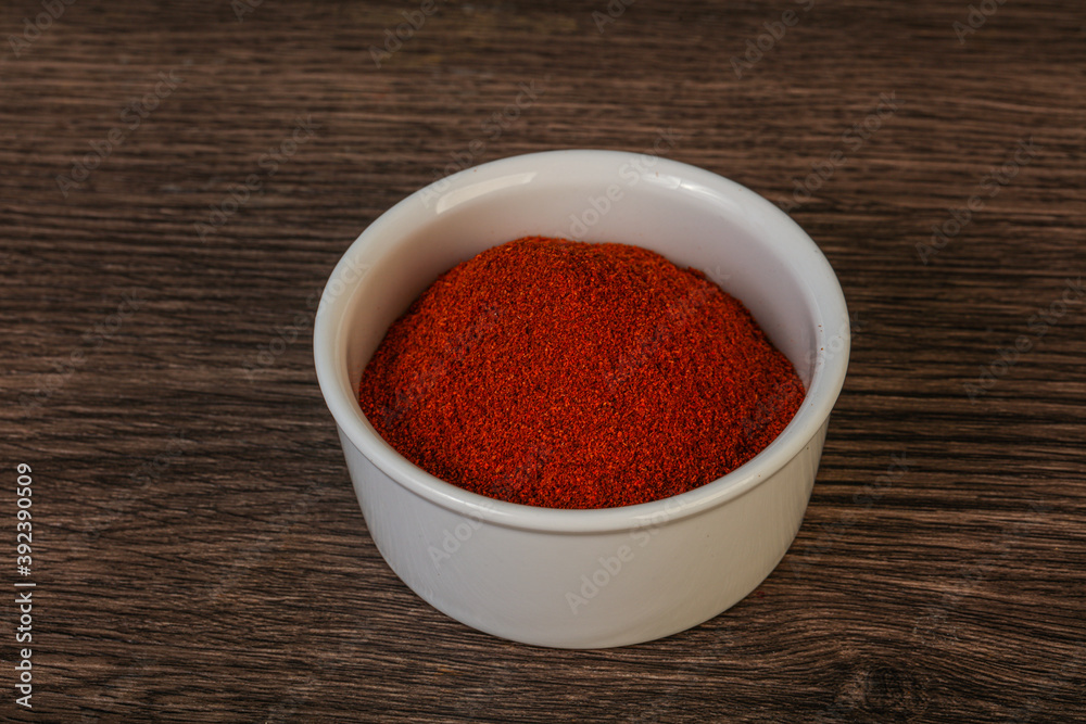 Dry paprika powder in the bowl Dry paprika powder in the bowl