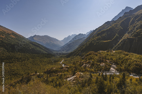 Canyon of mountain river with blue water. Autumn in Caucasus mountain. Hiking and eco tourism in mountain.