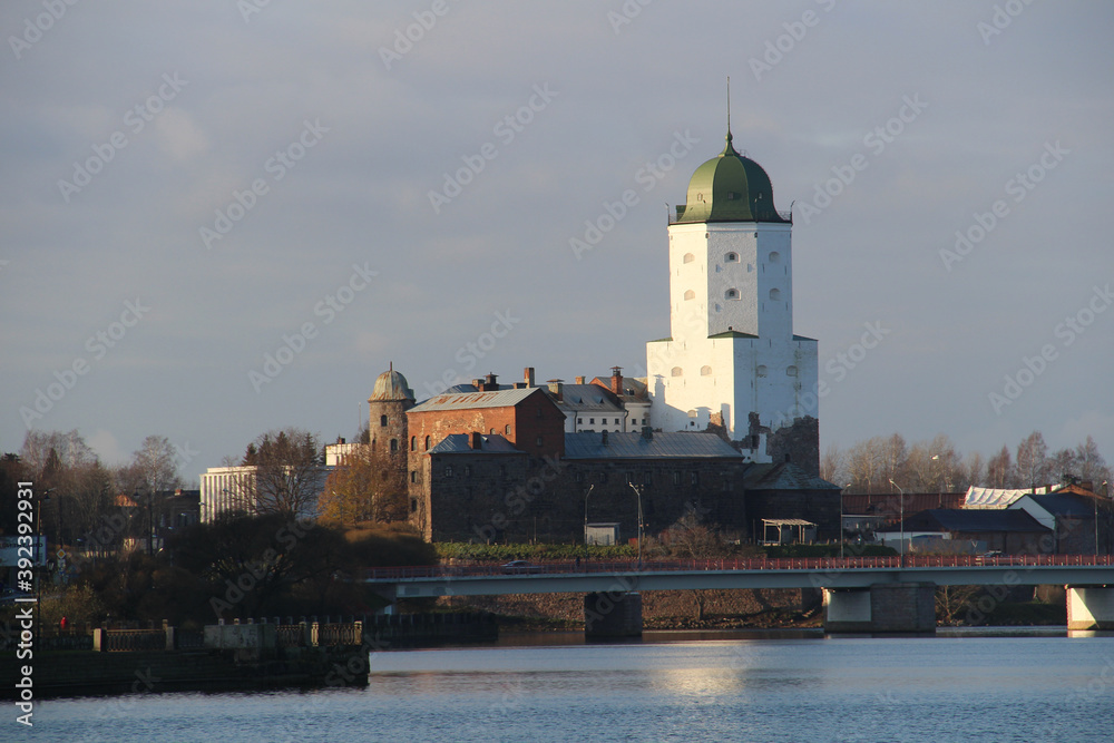 Ancient stone castle on the river bank in the city of Vyborg