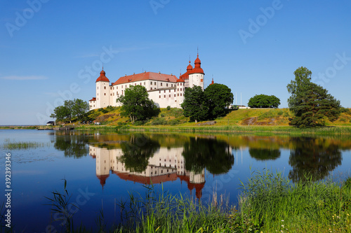 Scenic view of the Swedish medieval Lacko castle is a beautiful landmark reflected in the lake.
