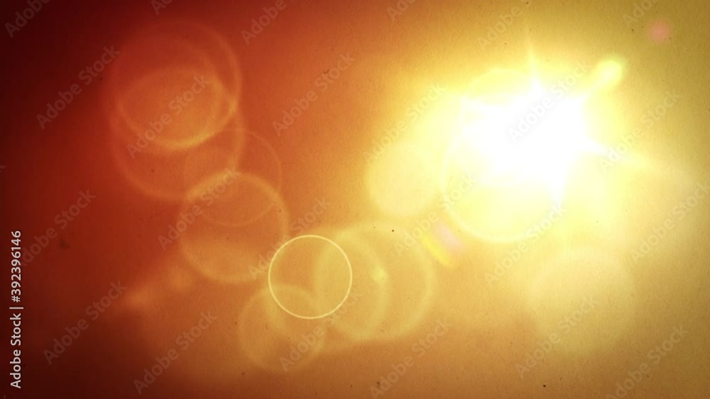 A warm yellow sun motion background that gives off an orange atmosphere and large outlined bokeh circles floating about with occasional camera light leaks flickering on under a film grainy texture.
