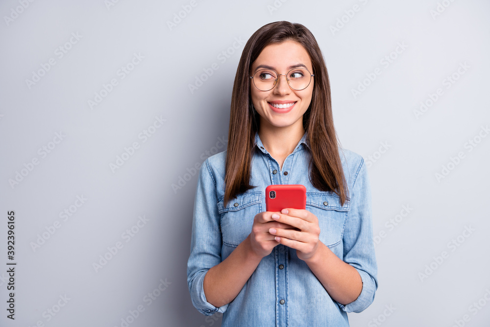 Portrait of attractive satisfied person look empty space new post idea isolated on grey color background Portrait of attractive satisfied person look empty space new post idea isolated on grey color background
