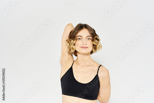 Woman in sportswear on a light background exercise fitness sport balance model
