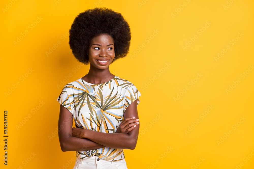 Portrait of cute optimistic short hair lady stand crossed arms look empty space dress bright t-shirt isolated on bright yellow color background Portrait of cute optimistic short hair lady stand crossed arms look empty space dress bright t-shirt isolated on bright yellow color background