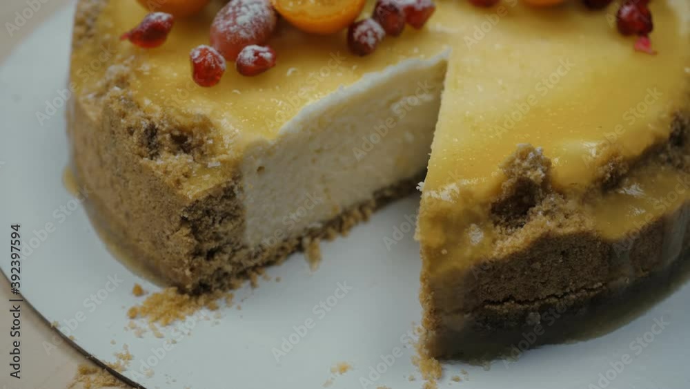 Cheesecake cake. Take one piece. Cut off, you can see the filling. Side view. Cheesecake cake. Take one piece. Cut off, you can see the filling. Side view.