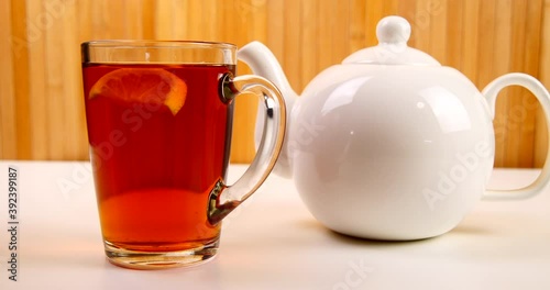 drink black tea in a transparent cup and teapot