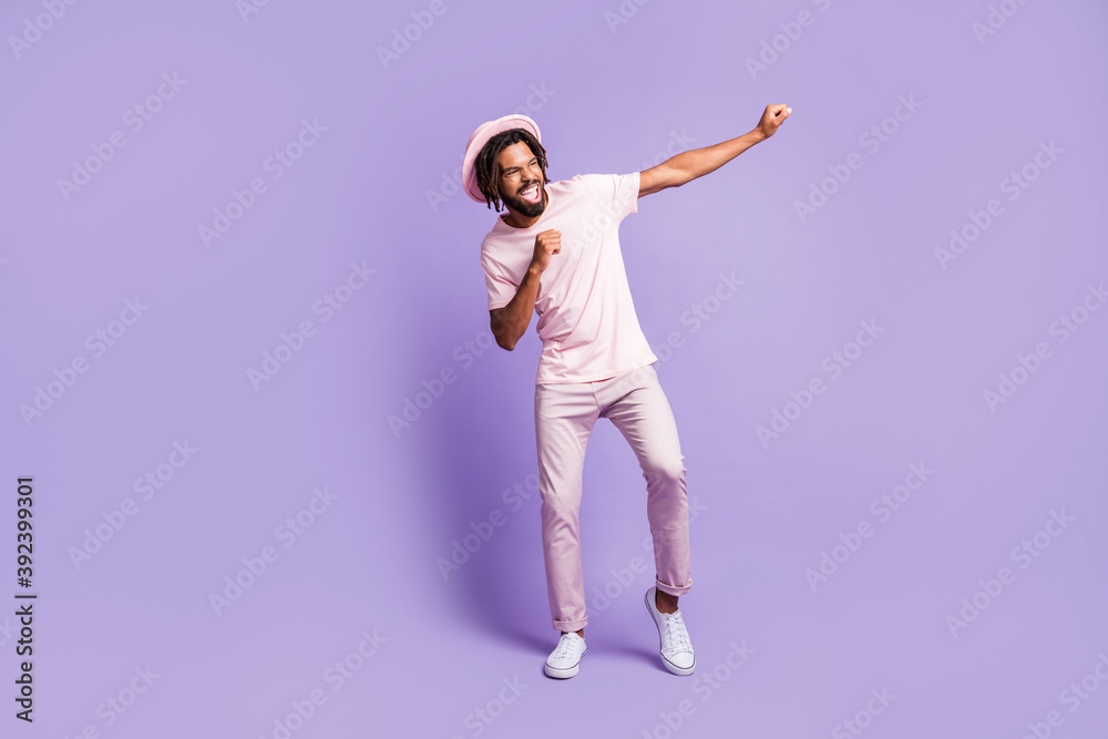 Full size photo of young handsome afro crazy excited happy man guy dancing look copyspace isolated on purple color background
