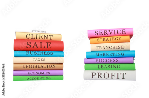 Piles of colorful business books isolated on a white background photo