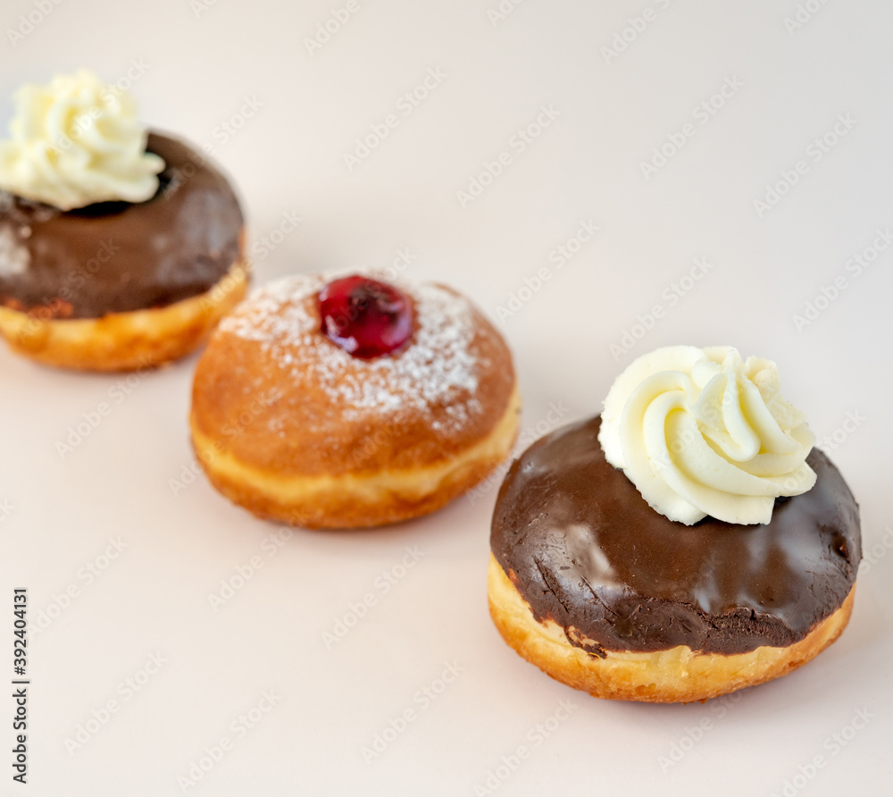Close up of fresh donuts for Hanukkah celebration. Selective focus. Close up of fresh donuts for Hanukkah celebration. Selective focus.