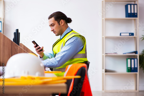 Young male architect working in the office