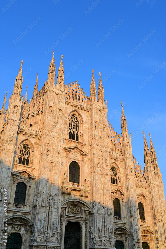 Milan duomo in the sunny day with sunset light