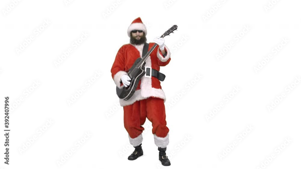 Funny Santa guitar player plays rock by guitar. Santa Claus is plaing acoustic guitar, singing on white background. Christmas coming Funny Santa guitar player plays rock by guitar. Santa Claus is plaing acoustic guitar, singing on white background. Christmas coming