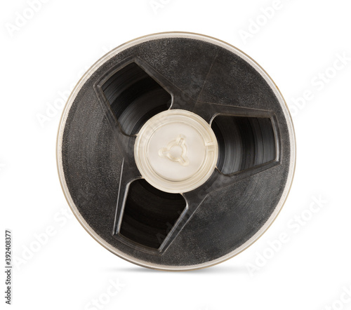 Vintage old magnetic audio tape reel isolated on white