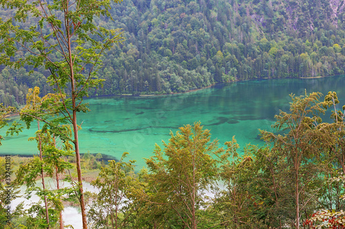 Looking down at the turquoise water of the Almsee, on the hike to the Ameisstein photo