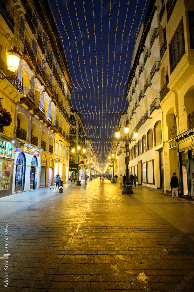 Very famous Alfonso street located in the center of the city, where at the end of it is the basilica del pilar, in Zaragoza, Spain. ZARAGOZA, SPAIN - 11/11/2020