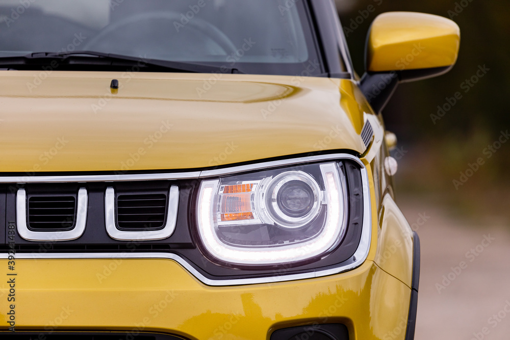 Front light of a yellow car