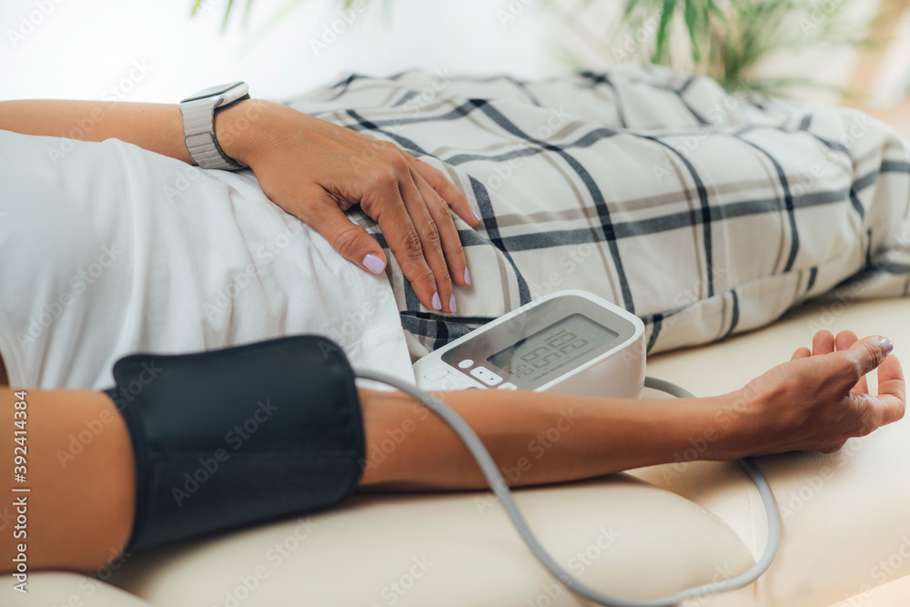 Fototapeta premium Measuring Orthostatic Blood Pressure at Home.