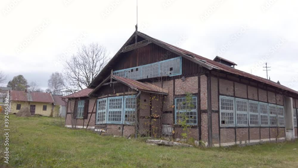 Slide view on an ancient manufacture building in a countryside. Old building in a village. Slide view on an ancient manufacture building in a countryside. Old building in a village.