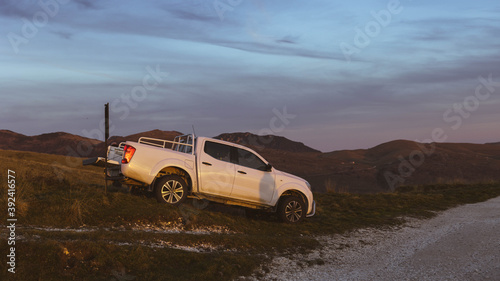 SUV on a mountain rocks © igor