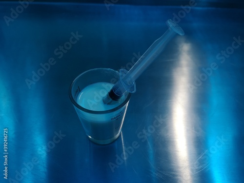 Medicine tube in a medicine glass on the table