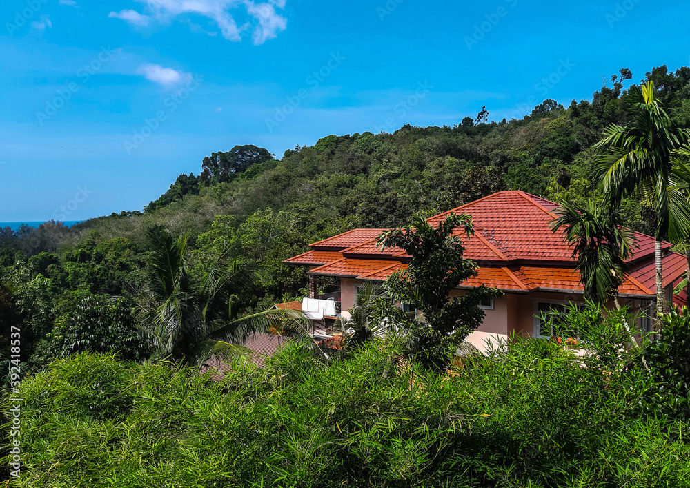 The orange-roofed villa is hiding in the dense, impenetrable jungles of Thailand.