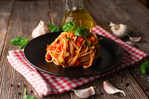 Spaghetti with eggplant, zucchini, paprika and tomato sauce