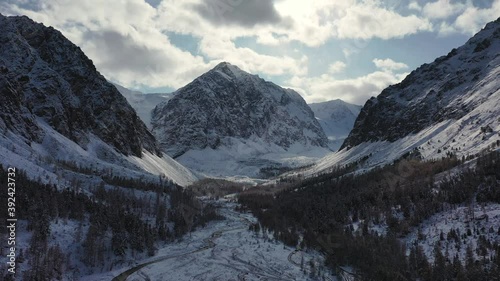 Russia's most popular travel destination, autumn scenery. Altai's spectacular snow-capped mountains reflect, frozen lakes and larch trees.