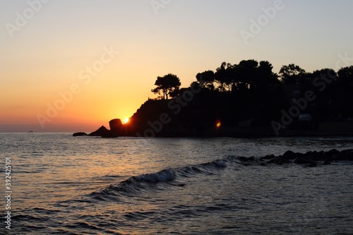 evocative image of sunrise over the sea with the sun rising over the horizon © massimo