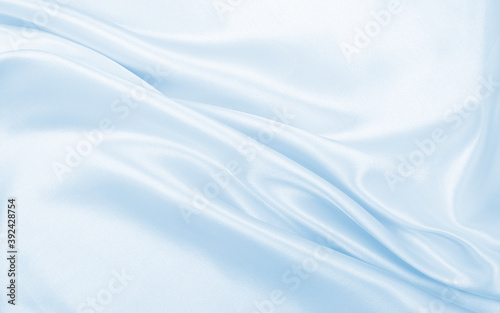 Smooth elegant blue silk or satin luxury cloth texture as abstract background. Luxurious background design © Oxana Morozova