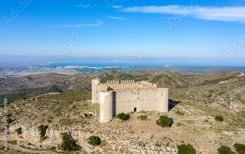 Medieval Castle called El Montgri at the top  mountain near the sea in Costa Brava, Spain photo