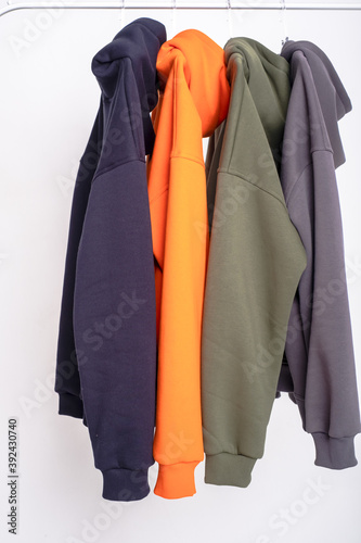 parts of multi-colored hoodie clothing close-up in a photo Studio