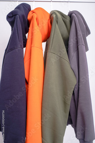 parts of multi-colored hoodie clothing close-up in a photo Studio