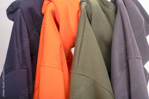 parts of multi-colored hoodie clothing close-up in a photo Studio