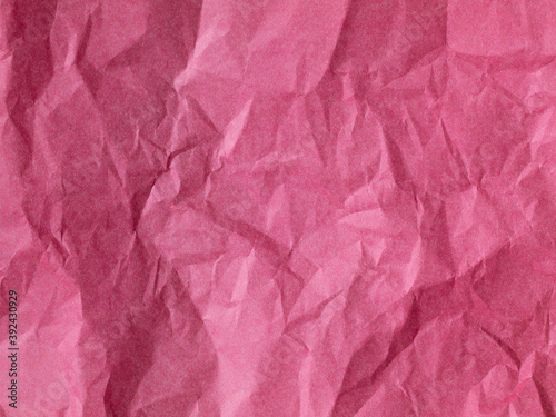 The texture of crumpled paper is maroon. top view