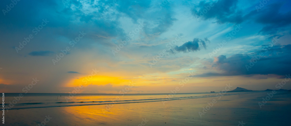 Colorful landscape view with clouds and sky at sunset, on the beach in summer. For web banner