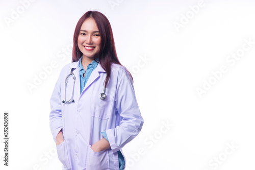 rofessional young woman doctor wear coat uniform with stethoscope looking at camera while standing smile over isolated white background. Healthy care and insurance concept.