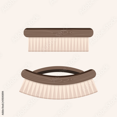 Wooden brush for hair or clothes isolated on beige background. ECO friendly concept.